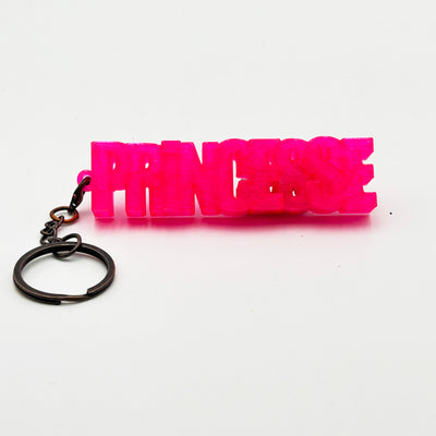 Porte-clés à message «Princesse », imprimé en 3D, présenté dans un tube à essai.